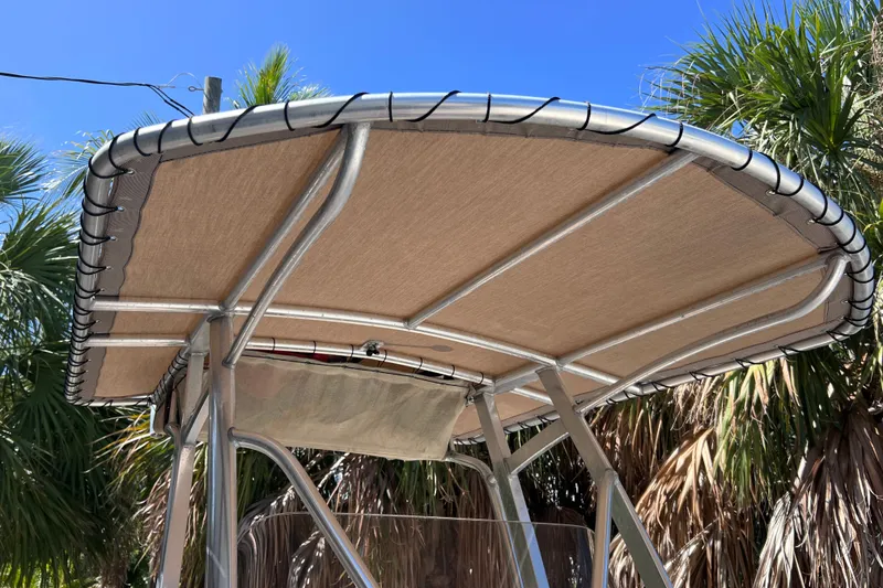 Slide: The Image of 2012 Scout 210 XSF boat canopy with metal frame against a clear blue sky. - 37