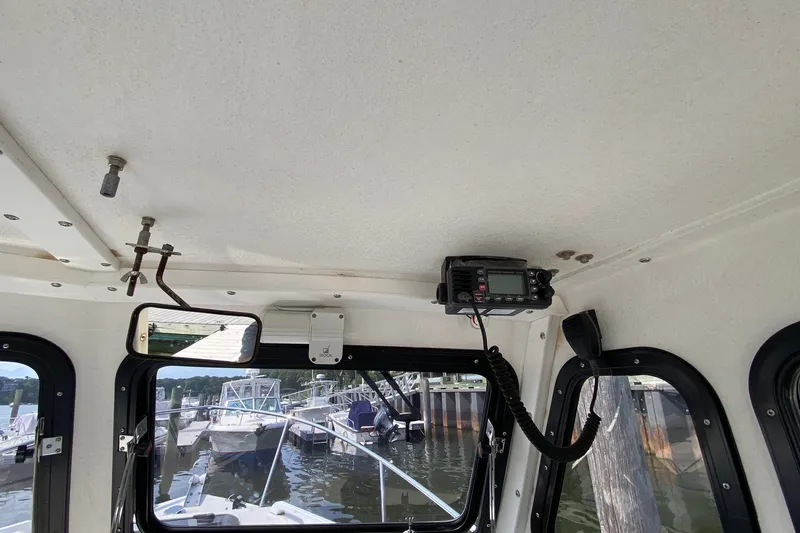 Slide: The Image of Interior view of 2017 Eastern 22 Sisu Hardtop boat with radio equipment. - 13