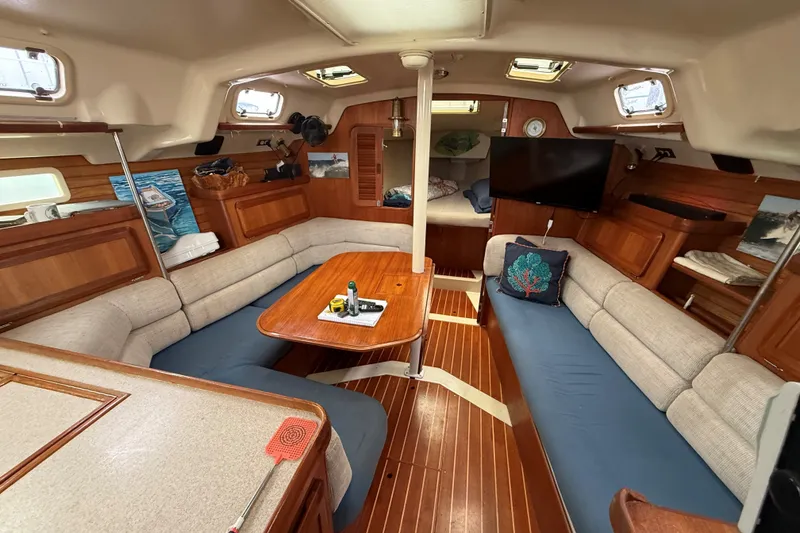 Slide: The Image of Interior of 1996 Hunter Legend 37.5 sailboat with cozy seating and wooden finishes. - 16