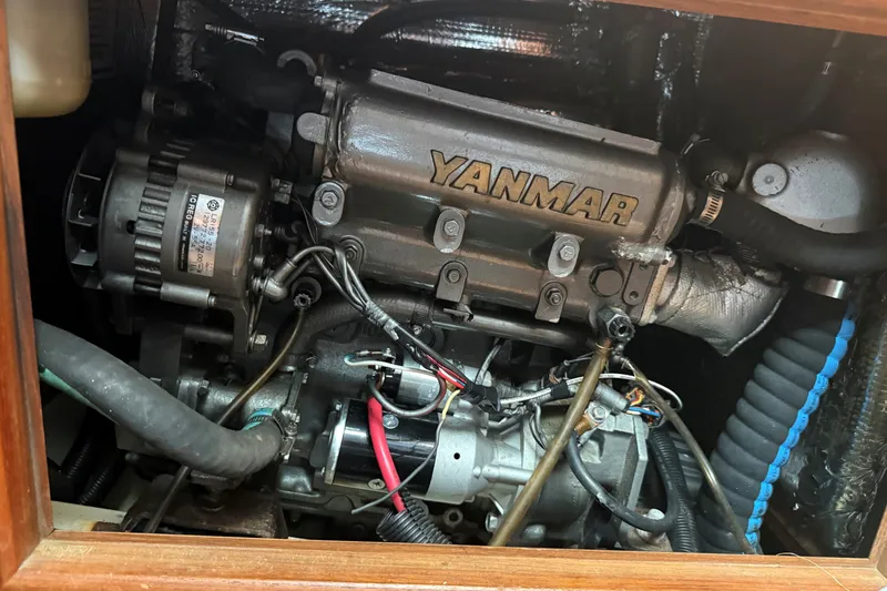 Slide: The Image of Yanmar engine inside a 1996 Hunter Legend 37.5 sailboat, showcasing detailed components. - 22