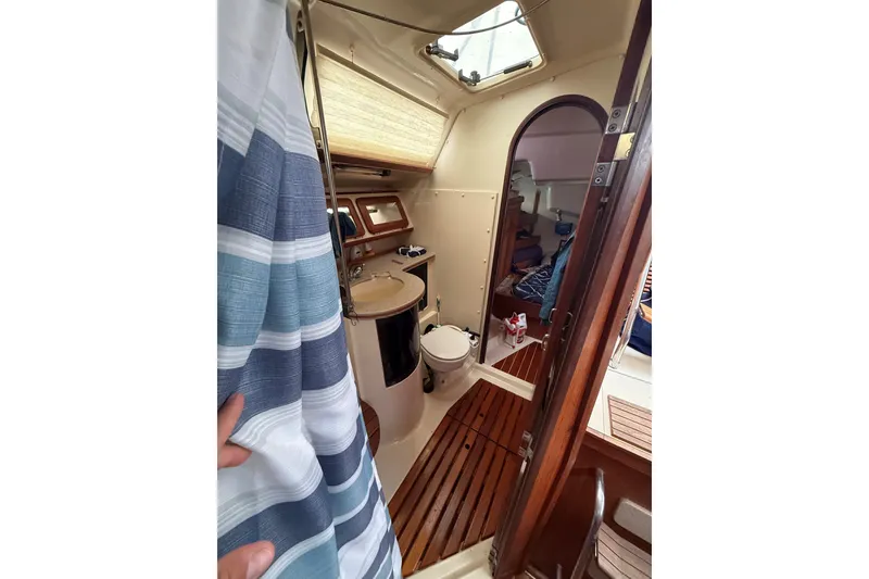 Slide: The Image of Interior of 1996 Hunter Legend 37.5 sailboat showing bathroom and cabin area. - 21