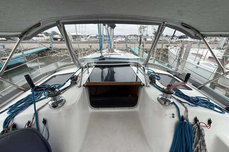 Slide: The Image of Cockpit view of 1996 Hunter Legend 37.5 sailboat docked at marina. - 11