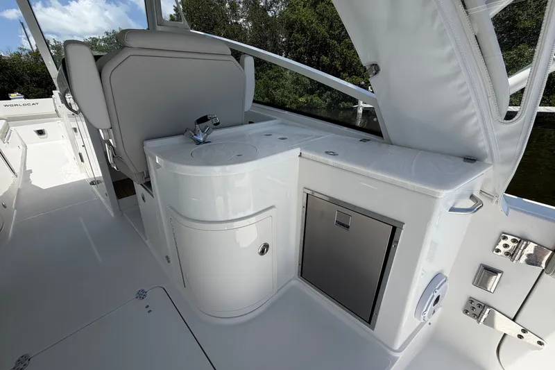 Slide: The Image of 2027 World Cat 325 DC boat interior with sleek seating and modern amenities. - 10