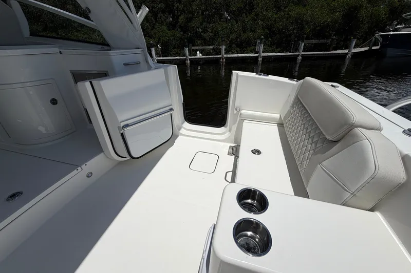 Slide: The Image of Luxurious interior of 2027 World Cat 325 DC boat with plush seating and cup holders. - 9