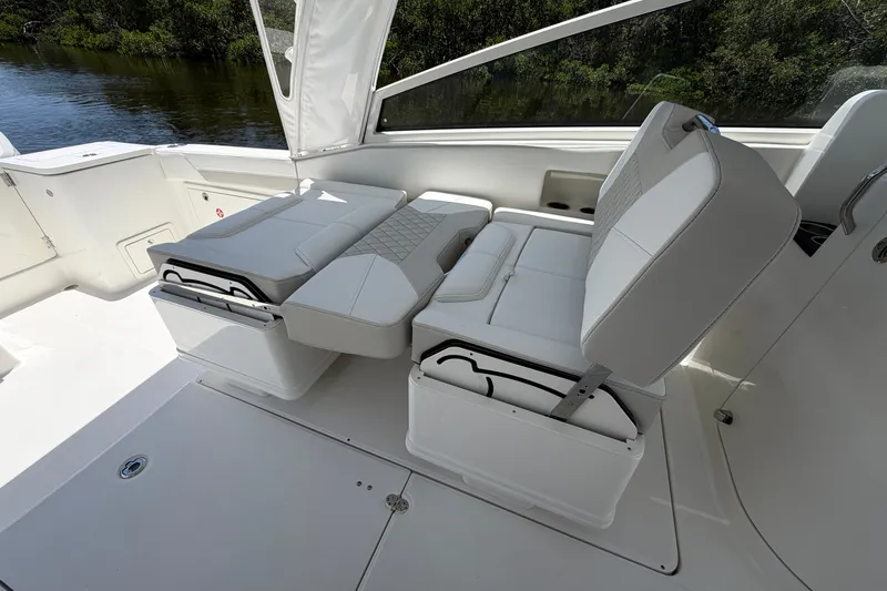 Slide: The Image of Luxurious seating on 2027 World Cat 325 DC boat, featuring white cushioned seats. - 13