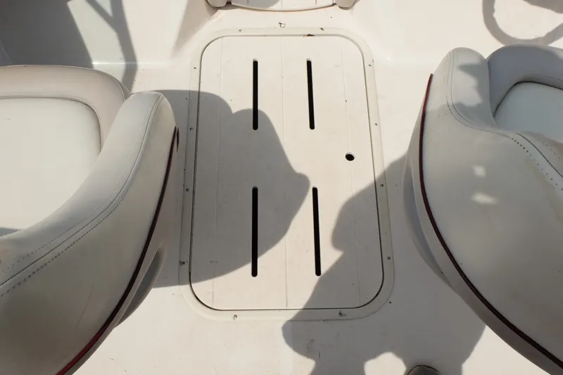 Slide: The Image of Interior of a 2009 Bryant 190 boat showing seating and deck hatch. - 14