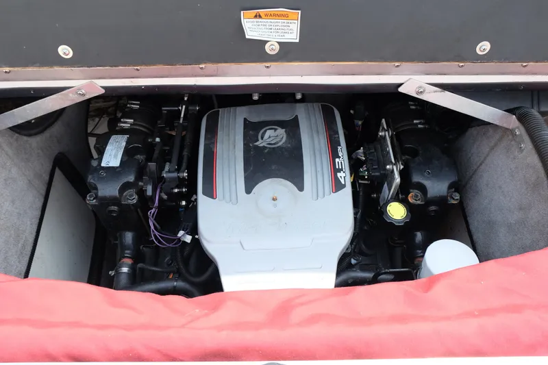 Slide: The Image of Engine compartment of a 2009 Bryant 190 boat, featuring a 4.3 MPI engine. - 16