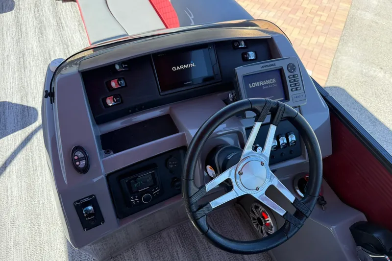 Slide: The Image of 2020 Bennington SXP 25 SSBXP boat dashboard with Garmin and Lowrance displays. - 18