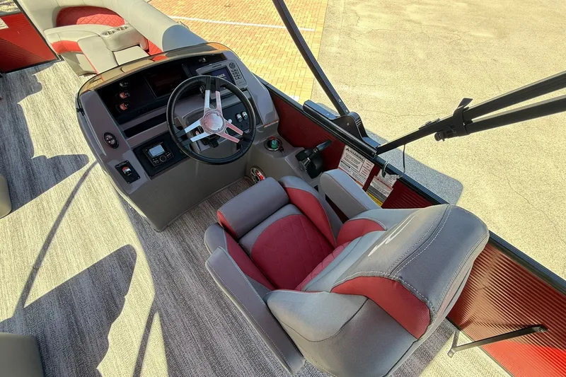 Slide: The Image of 2020 Bennington SXP 25 SSBXP boat interior with steering wheel and captain's chair. - 17