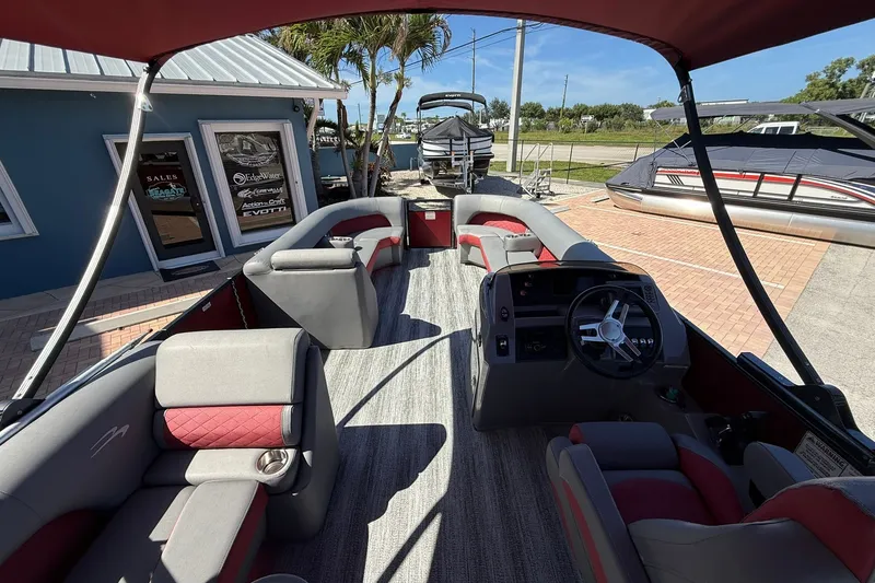 Slide: The Image of 2020 Bennington SXP 25 SSBXP pontoon boat interior with seating and steering console. - 16