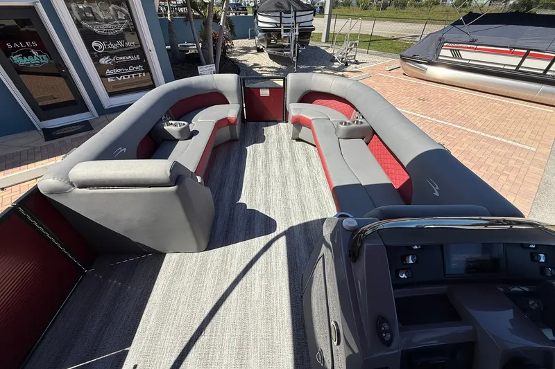 Slide: The Image of 2020 Bennington SXP 25 SSBXP pontoon boat interior with gray and red seating. - 26