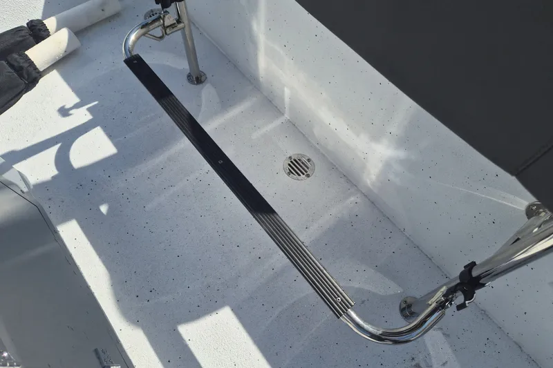 Slide: The Image of 2027 Xpress H20 Bay boat interior with stainless steel fittings and non-slip flooring. - 8