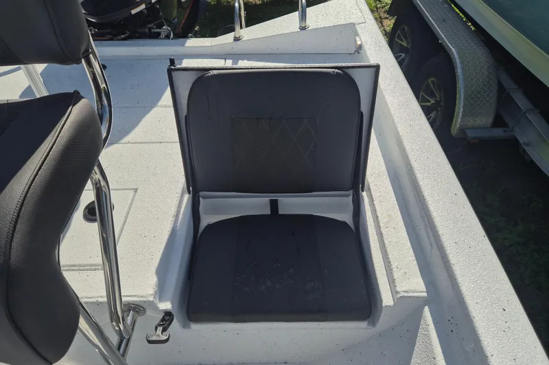 Slide: The Image of 2027 Xpress H20 Bay boat seat with sleek black upholstery and stainless steel frame. - 9