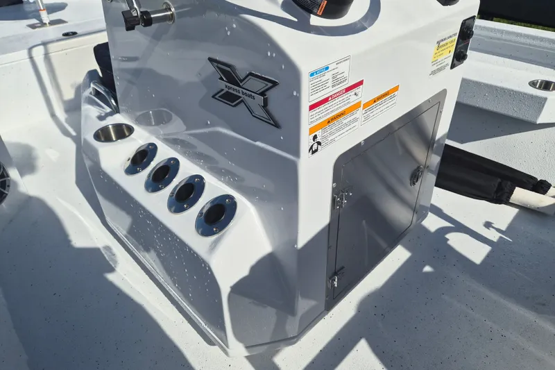 Slide: The Image of 2027 Xpress H20 Bay boat console with cup holders and storage compartment. - 11