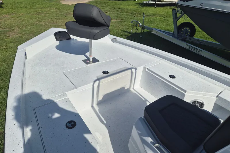 Slide: The Image of 2027 Xpress H20 Bay boat interior with seating and storage compartments. - 18