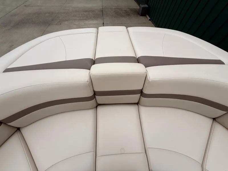 Slide: The Image of The bow seating area of a 2006 Chaparral SSi 256 features cream and brown upholstery. - 35