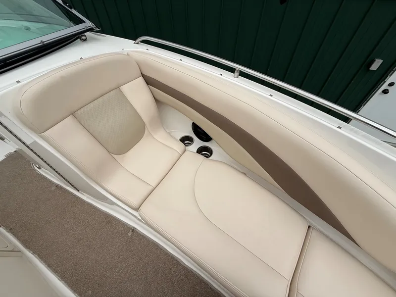 Slide: The Image of 2006 Chaparral SSi 256 with beige and brown upholstered seating area. - 13