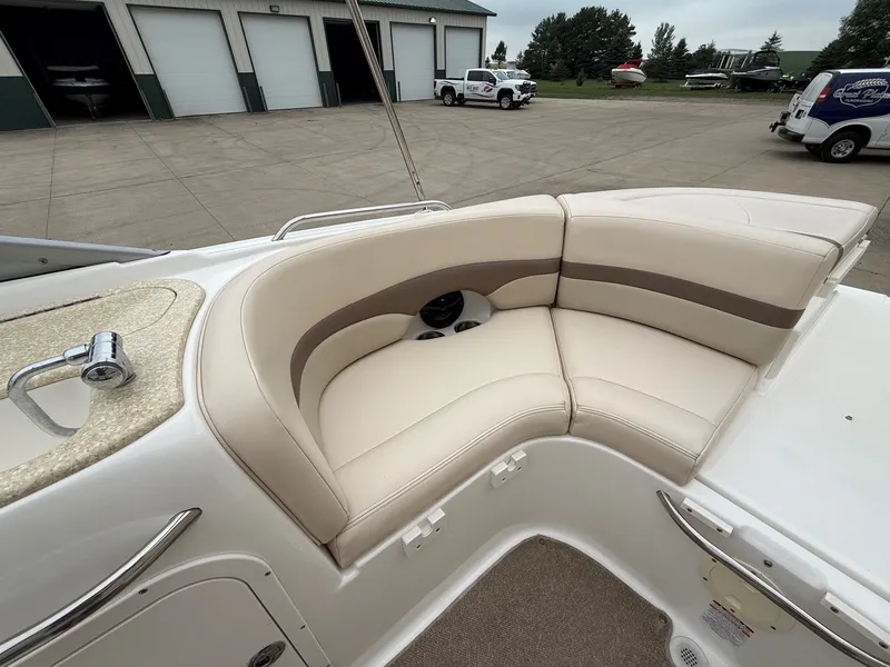 Slide: The Image of The image shows a cream-colored seating area on a boat, surrounded by an open setting. - 26