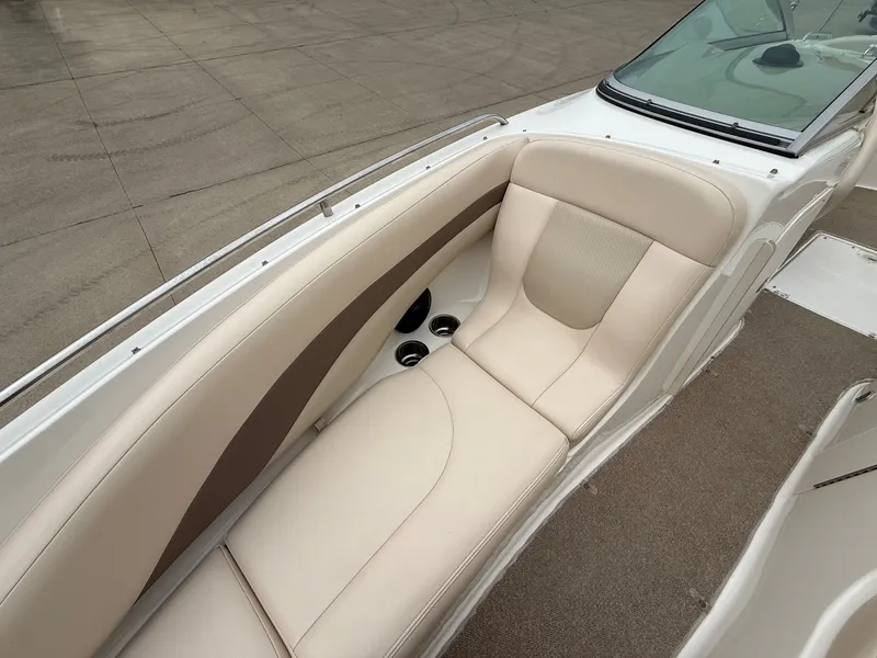 Slide: The Image of The image shows the cockpit of a 2006 Chaparral SSi 256 with beige leather seating. - 12