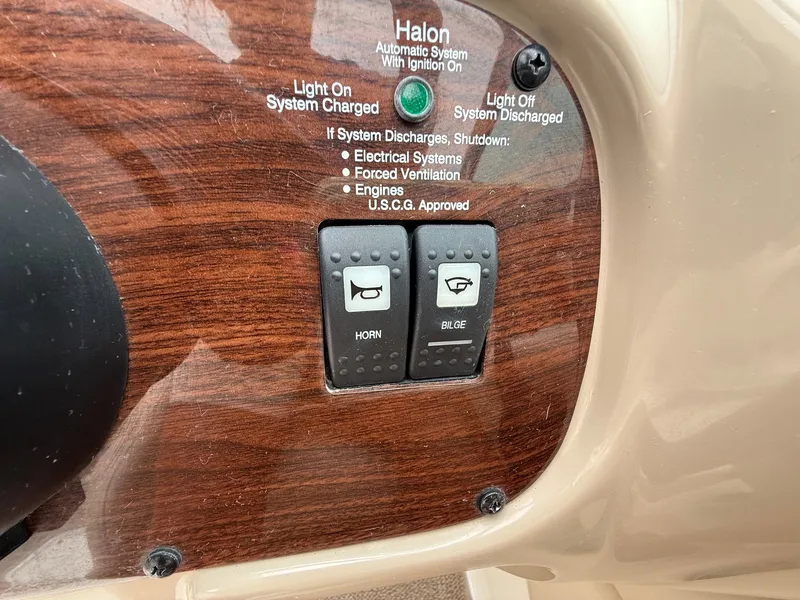 Slide: The Image of Close-up of a 2006 Chaparral SSi 256 dashboard with horn and bilge switches. - 19