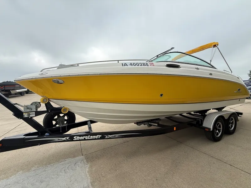 Slide: The Image of 2006 Chaparral SSi 256 with a yellow hull on a trailer. - 3