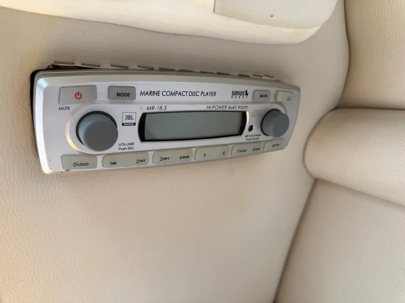 Slide: The Image of A JBL marine CD player is installed in the white interior paneling of a boat. - 34