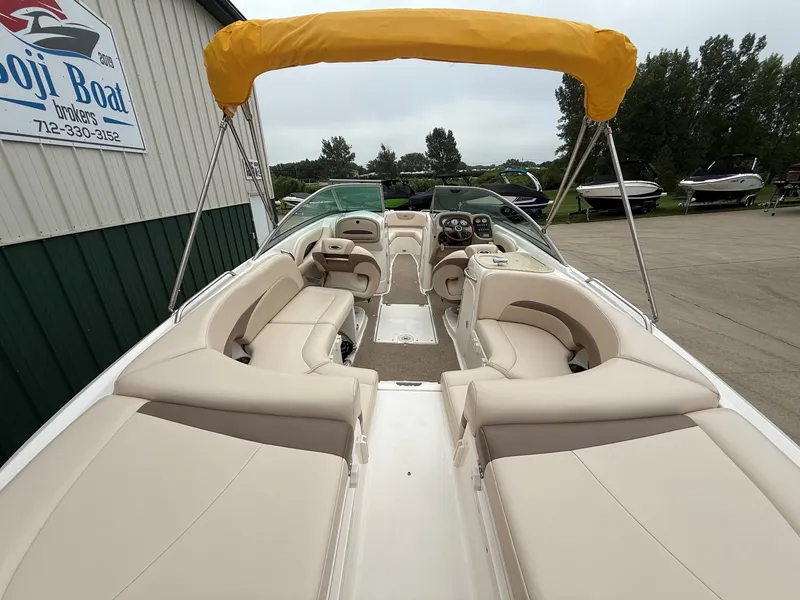 Slide: The Image of 2006 Chaparral SSi 256 with yellow sunshade, comfortable seating, and modern cockpit. - 10