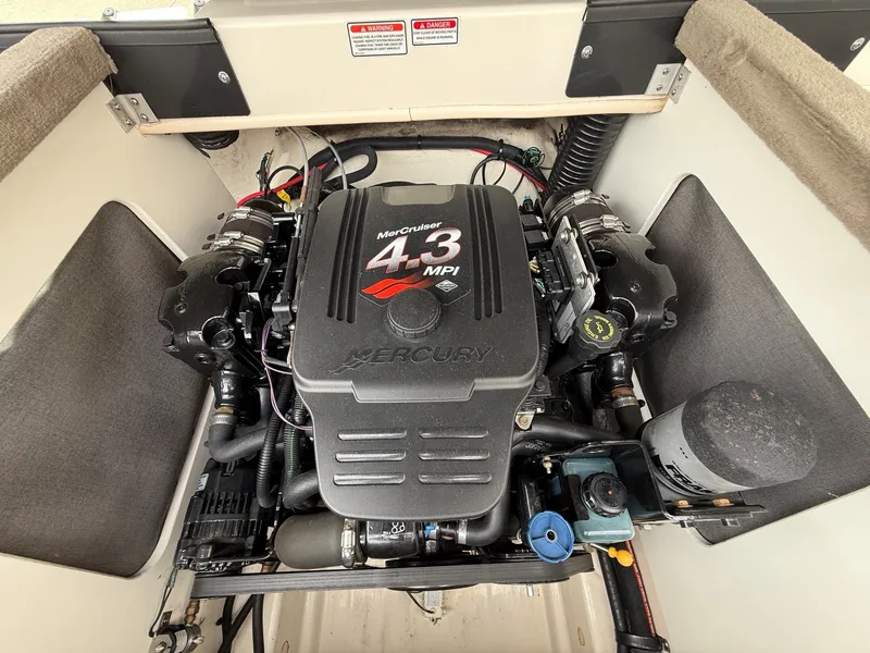 Slide: The Image of The 2005 Sea Ray 200 Sport features a MerCruiser 4.3 MPI engine in a clean engine compartment. - 18