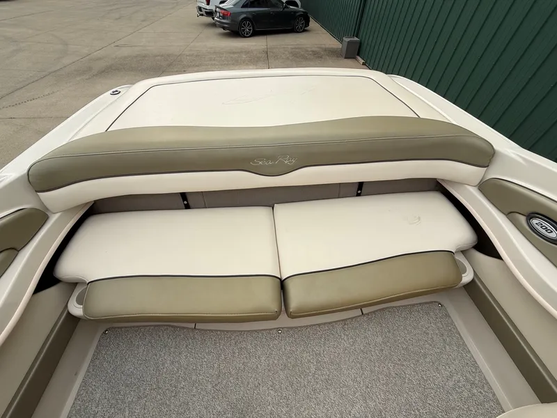 Slide: The Image of Rear view of a 2005 Sea Ray 200 Sport with beige and olive green upholstery. - 17