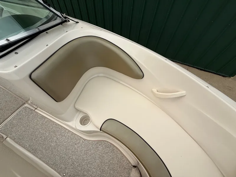 Slide: The Image of Interior view of a 2005 Sea Ray 200 Sport with beige and gray upholstery. - 11