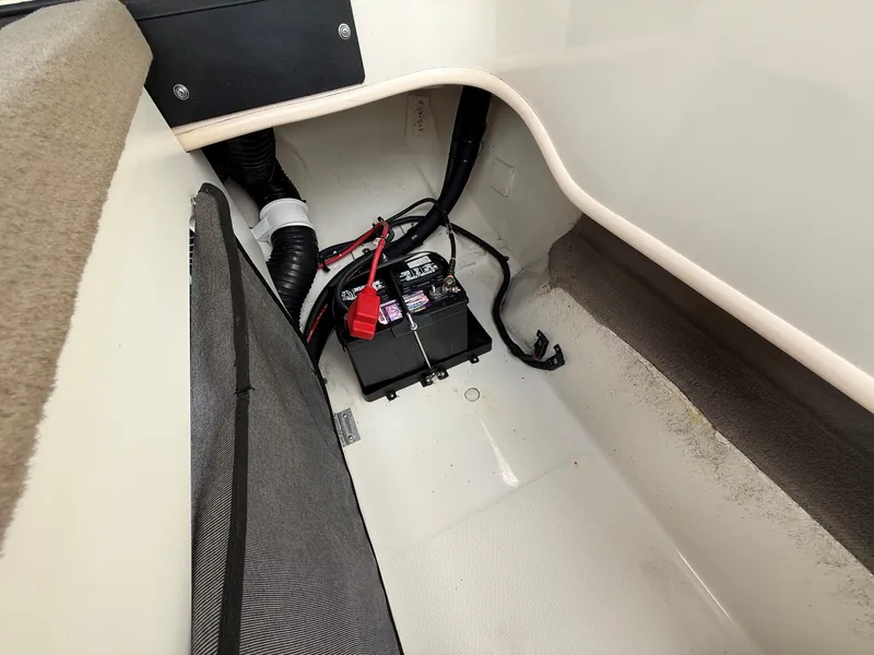 Slide: The Image of View of the battery compartment in a 2005 Sea Ray 200 Sport with cables and ventilation. - 19