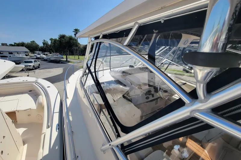 Slide: The Image of 2005 Grady-White Express 330 boat with sleek design and spacious cockpit area. - 13