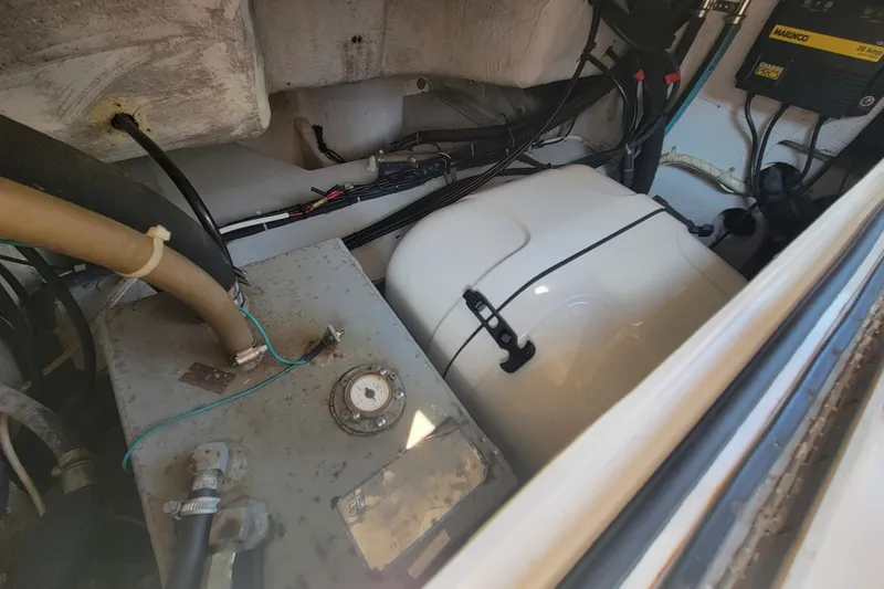 Slide: The Image of Engine compartment of a 2005 Grady-White Express 330 boat, showing wiring and components. - 12