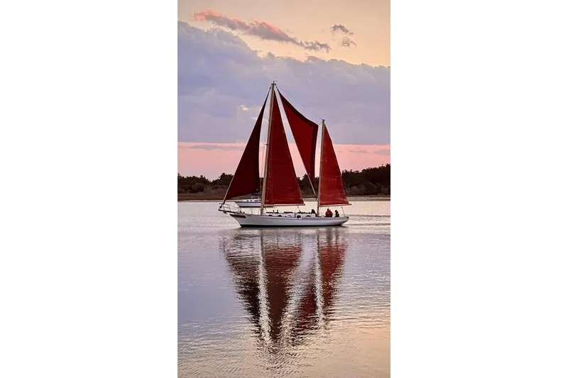 Slide: The Image of Sailboat on calm water at sunset, Nereia Yachts 38, 1985 model. - 3