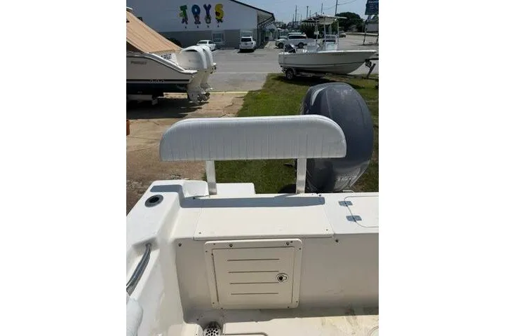 Slide: The Image of 2010 Cobia 216 Center Console boat interior with seating and storage compartment. - 16