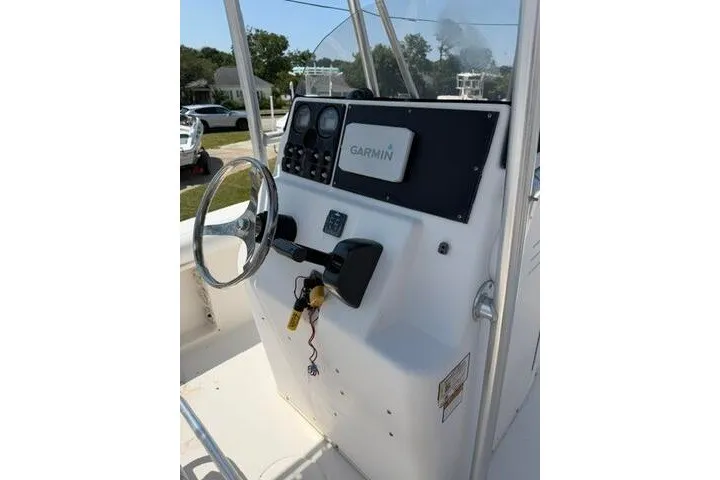 Slide: The Image of 2010 Cobia 216 Center Console boat dashboard with Garmin navigation system. - 15