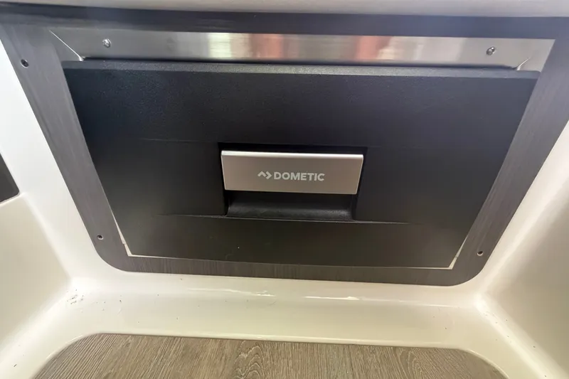 Slide: The Image of Dometic appliance in 2025 Navan S30 interior, featuring sleek black and silver design. - 27