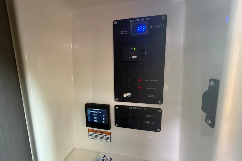Slide: The Image of Control panel of 2025 Navan S30 with voltage display and warning label. - 23