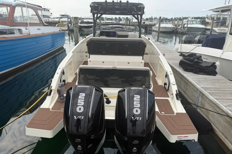 Slide: The Image of 2025 Navan S30 boat docked with dual Mercury 250 V8 engines. - 6