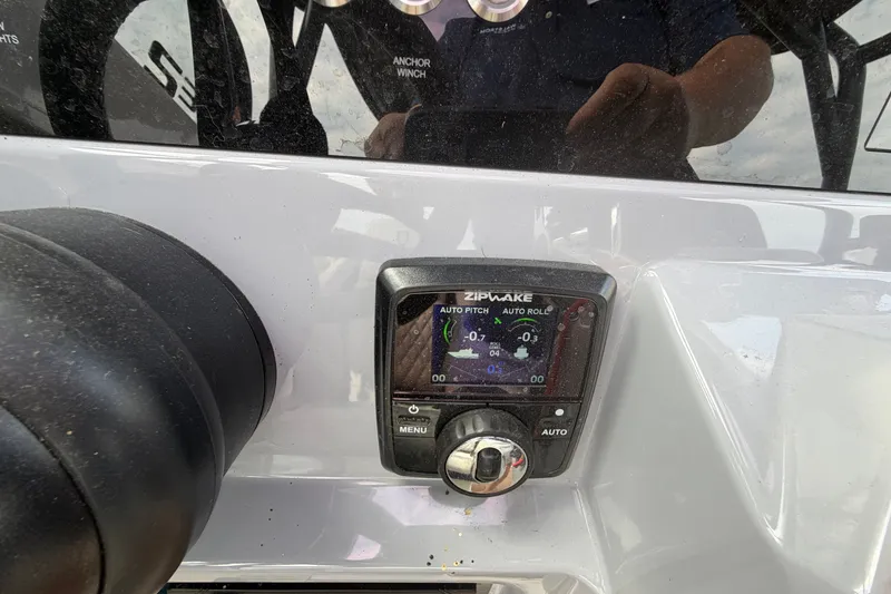 Slide: The Image of Control panel of a 2025 Navan S30 boat featuring a Zipwake system. - 20