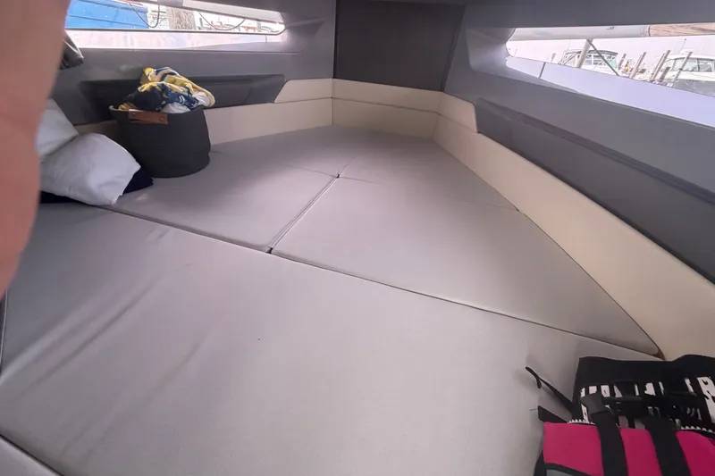 Slide: The Image of Interior cabin of 2025 Navan S30 boat with cushions and storage. - 24