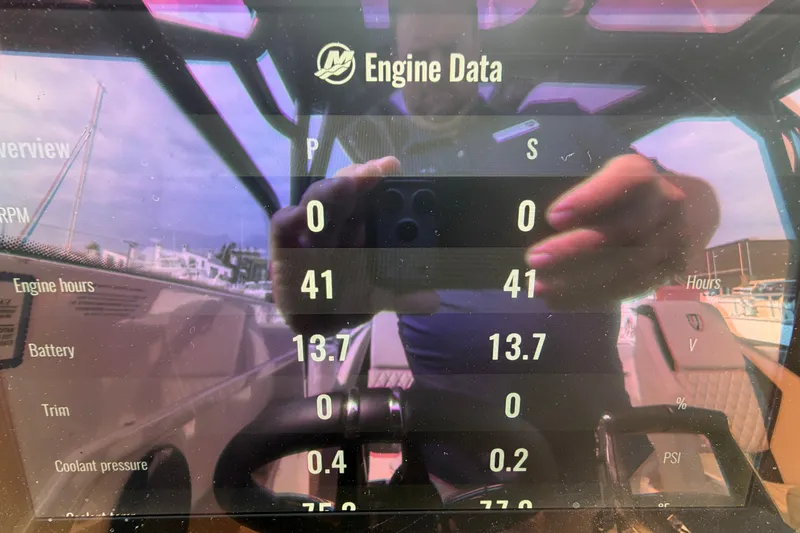 Slide: The Image of Display screen showing engine data for Navan S30, 2025 model, with reflection. - 21