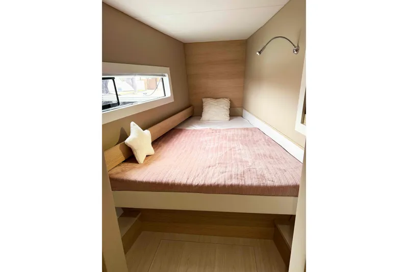 Slide: The Image of Cozy cabin interior of 2026 Aventura 37 Explorer Trawler with bed and window. - 28