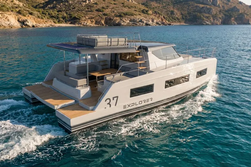 Slide: The Image of 2025 Aventura 37 Trawler cruising in scenic coastal waters. - 4
