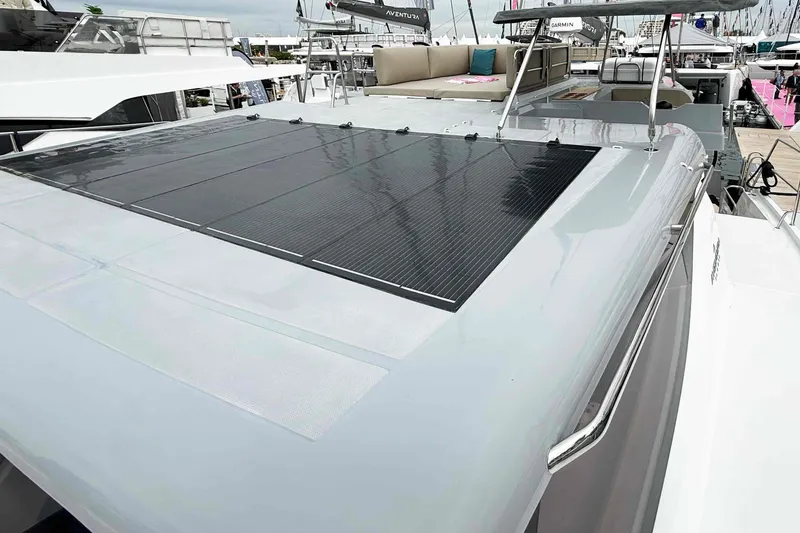 Slide: The Image of Aventura 37 Explorer Trawler 2026 with solar panels on deck, docked at marina. - 32