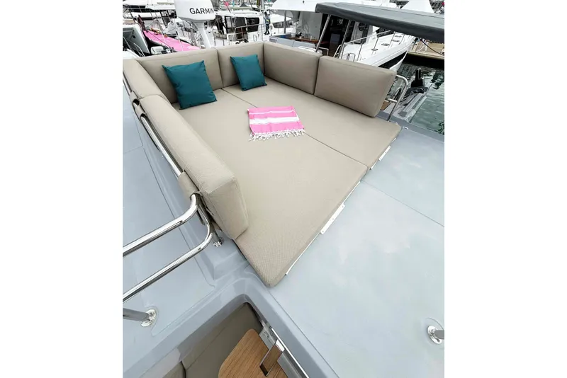 Slide: The Image of Luxurious sunbed on 2026 Aventura 37 Explorer Trawler with cushions and pink towel. - 36