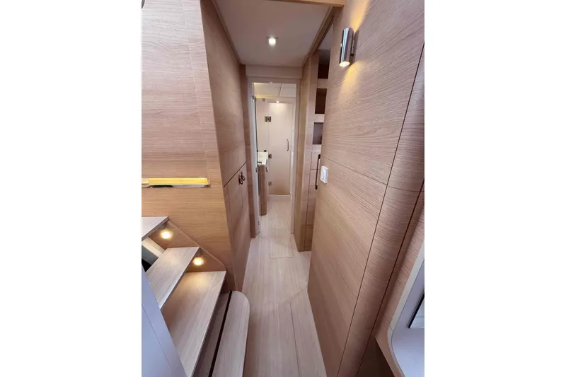 Slide: The Image of Interior hallway of 2026 Aventura 37 Explorer Trawler, featuring modern wood paneling and ambient lighting. - 25