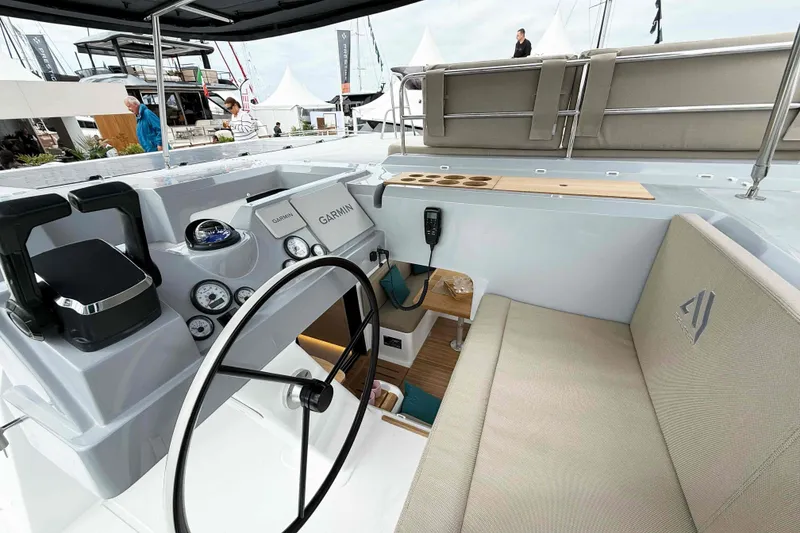 Slide: The Image of Cockpit of 2026 Aventura 37 Explorer Trawler with Garmin navigation system and seating area. - 1