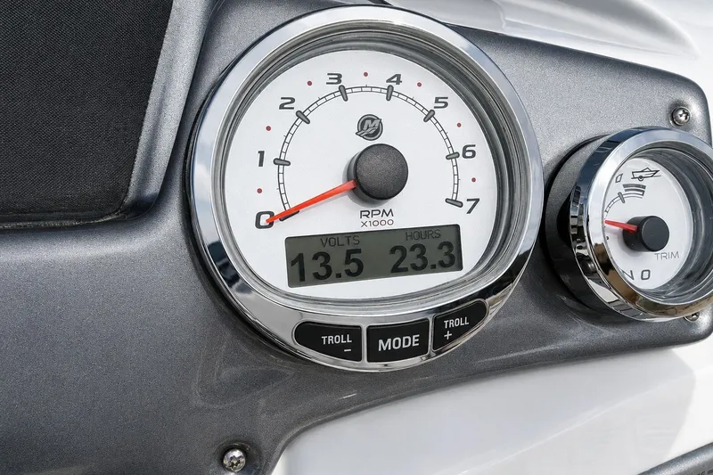 Slide: The Image of Close-up of 2022 Tahoe 2150 boat dashboard gauges displaying RPM, volts, and trim settings. - 42