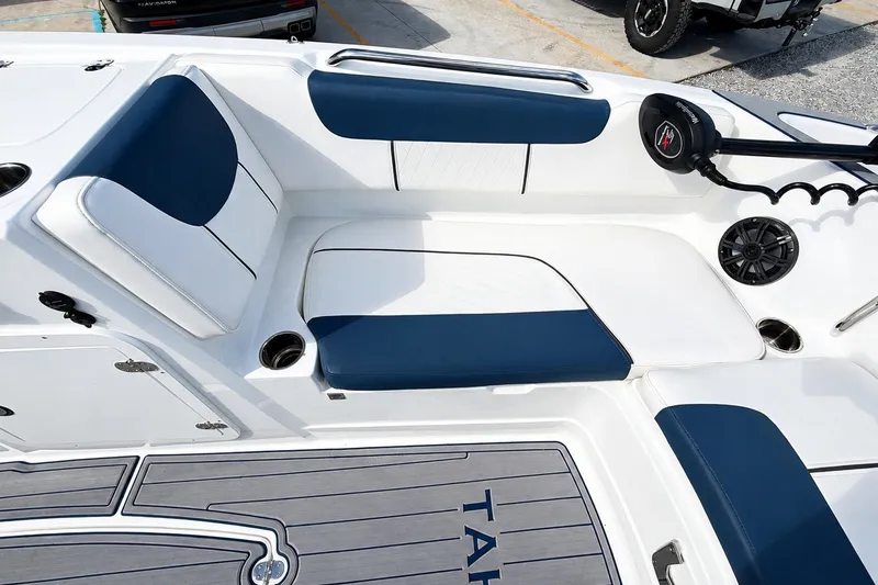 Slide: The Image of 2022 Tahoe 2150 boat interior with blue and white seating and modern design. - 25